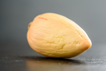 avocado stone on a black wooden background