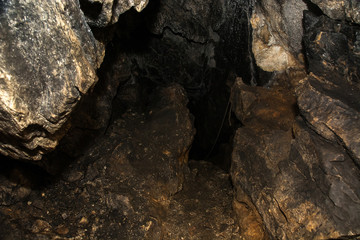 View inside a deep cave. The dark abyss.