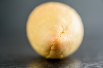 avocado stone on a black wooden background