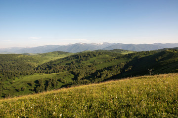 Mountain landscape. At a distance you can see the snow on top of the mountain.