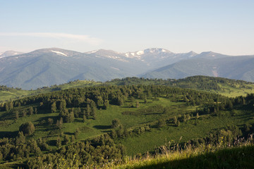 Obraz premium Mountain landscape. At a distance you can see the snow on top of the mountain.
