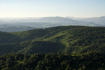 Fototapeta premium Mountain landscape. At a distance you can see the snow on top of the mountain.