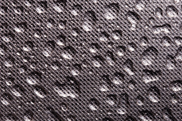 Perforated metal with water drops texture