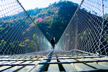 MAN  CROSSING HILL BRIDGE 