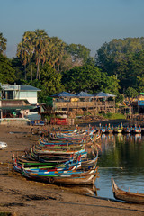 Mandalay. Myanmar. 11/21/2016. Lake Taungthaman. Every morning, dozens of colorful boats float on...
