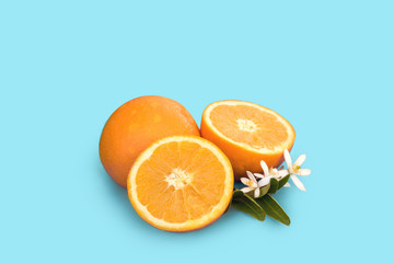 Delicious Orangr fruit isolate. Orange with leaves isolated on blue