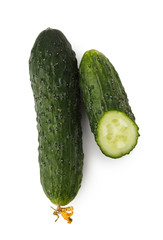 Green cucumber whole cut in half, isolated