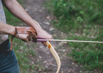 Archer tightening the arrow before shooting