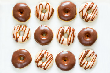 Sweet donuts with chocolate coating. Flat lay. Top view