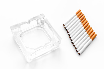 Smoking. Half-smoked cigarettes near ashtray on white background mockup