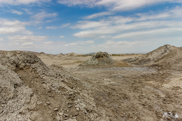 Ancient warm mud volcanoes that swirl with dirt from the bowels of the earth.