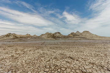 Ancient warm mud volcanoes that swirl with dirt from the bowels of the earth.