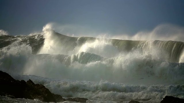 Ocean storm sea spray big waves landscape coast blue sky 