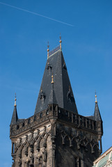 Fototapeta na wymiar Upper part of facade and roof of old beautiful cathedral in Prague, Czech Republic 