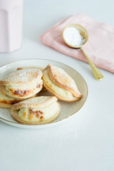 Cookies with cottage cheese sprinkled with powdered sugar.
