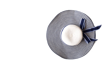 Sun hat on white isolate background. Top view with copy space. White and navy blue color striped...
