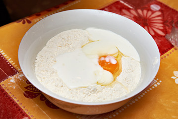 Large bowl with ingredients for dough