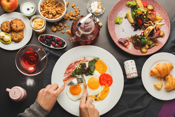 Restaurant breakfast with bacon and fried eggs