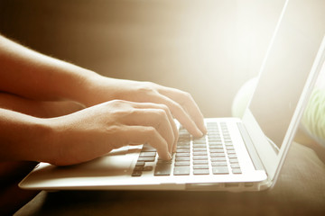 Women hands working using laptop feeling relax..not at office or work at home. working and studying concept.