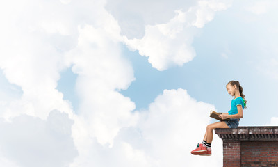 Concept of careless happy childhood with girl exploring this world