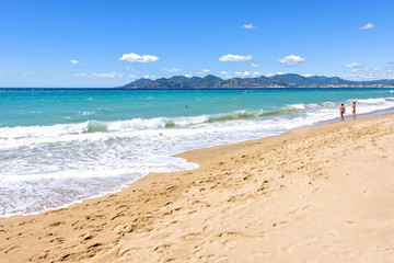 Daylight sunny view to beachline and sea of Cannes resort in Fra