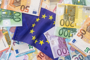euro bills on the european flag background.