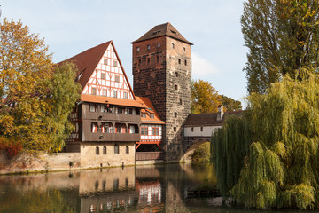 Obraz premium View to medieval bridge and defence tower in the centre of Nuremberg, Germany