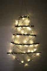 Christmas tree with xmas toys, balls and lights, handmade