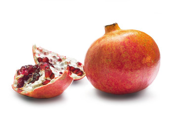 Pomegranate and 2 cut pieces of pomegranate isolated on white background