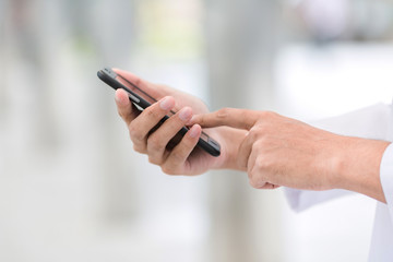 Arab business use mobile phone to connect to customer.