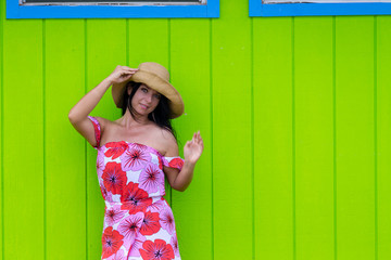 Fototapeta premium Pretty woman in a straw sunhat in Hawaii