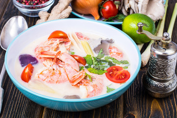 Delicious hot Thai soup Tom Yam with coconut milk and shrimps