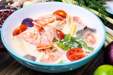 Delicious hot Thai soup Tom Yam with coconut milk and shrimps