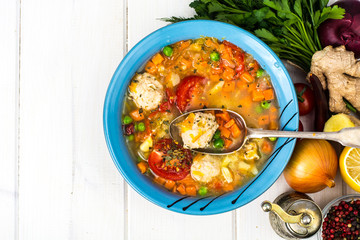 Chicken broth with vegetables and meatballs