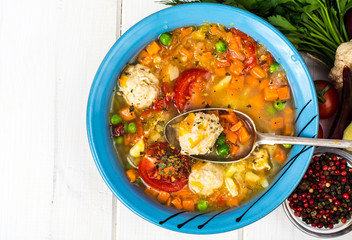 Chicken broth with vegetables and meatballs