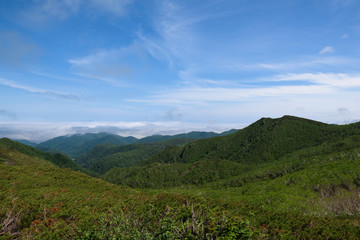 Fototapeta na wymiar Panoramic views from the green Shiretoko Pass around Mount Rausu in Shiretoko National Park, Hokkaido, Japan
