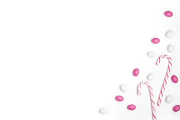 Frame Pink and White candies and lollipops Top view White Background Valentine's Day