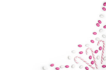 Frame Pink and White candies and lollipops Top view White Background Valentine's Day