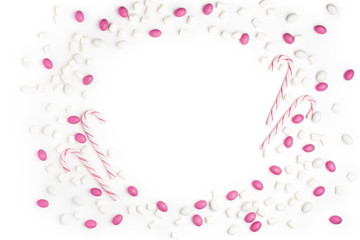 Frame Pink and White candies and lollipops Top view White Background Valentine's Day