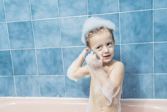 Child playing with the shower head