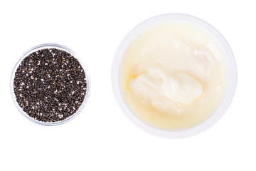 Healthy Eating. Natural yoghurt with chia seeds on white background