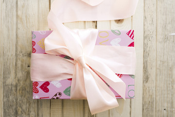 pink gift box with a bow top view