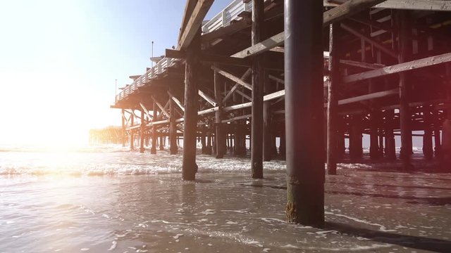 High quality video of walking under pier in San Diego in real 1080p slow motion 120fps