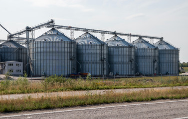 Fototapeta na wymiar Elevator for grain storage. Grain dryer..Agricultural complex.