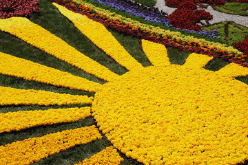 Fototapeta na wymiar KIEV, UKRAINE - AUGUST 23: Big yellow sun made of flowers at the flower exhibition on August 23, 2008 in Kiev, Ukraine. 