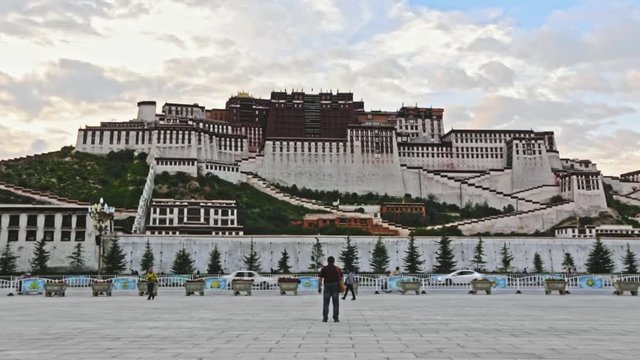 View of the majestic POTALA PALACE in Lhasa &mdash; iconic TIBETAN architecture and sacred Buddhist landmark with people in the foreground