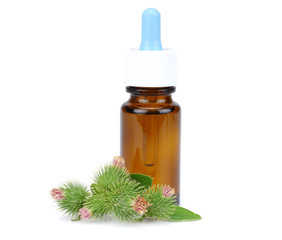 bottle with burdock (castor, agrimony) oil isolated on white background