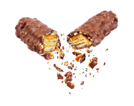 Waffle chocolate bar with nuts broken into two parts close up, isolated on white background