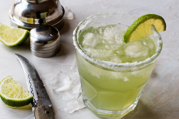 Classic Margarita Cocktail in Salted Glass with Lime and Crushed ice.
