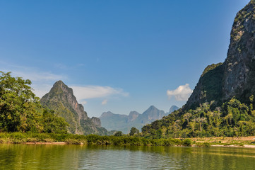 Naklejka na ściany i meble Riverside landscape on the Mekong river in Laos